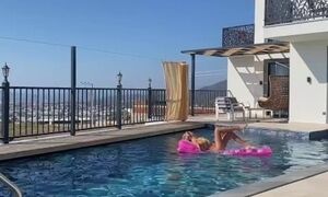 'a beautiful blonde masturbates in the pool and lures a peeping guy into a blowjob'