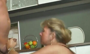 Mature couple pissing fucking in the kitchen