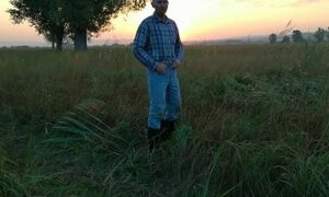 The farmer pees several times in different places in the field