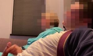 'Casual handjob from wife while watching tv on couch'