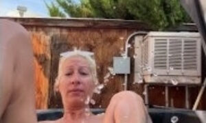 Piss Slut floating in her hot tub and pissing like a fountian!!